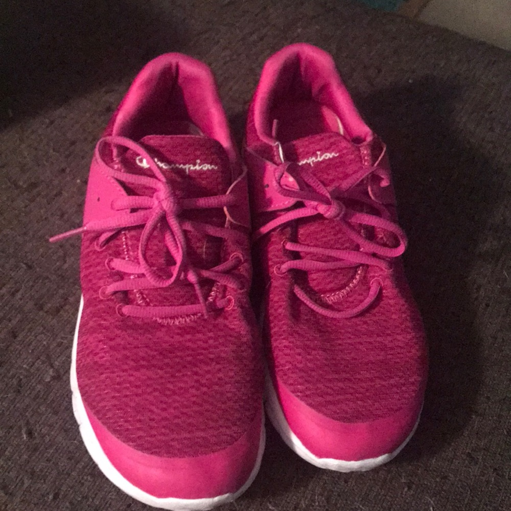 Pink gym shoes and green and orange cleats